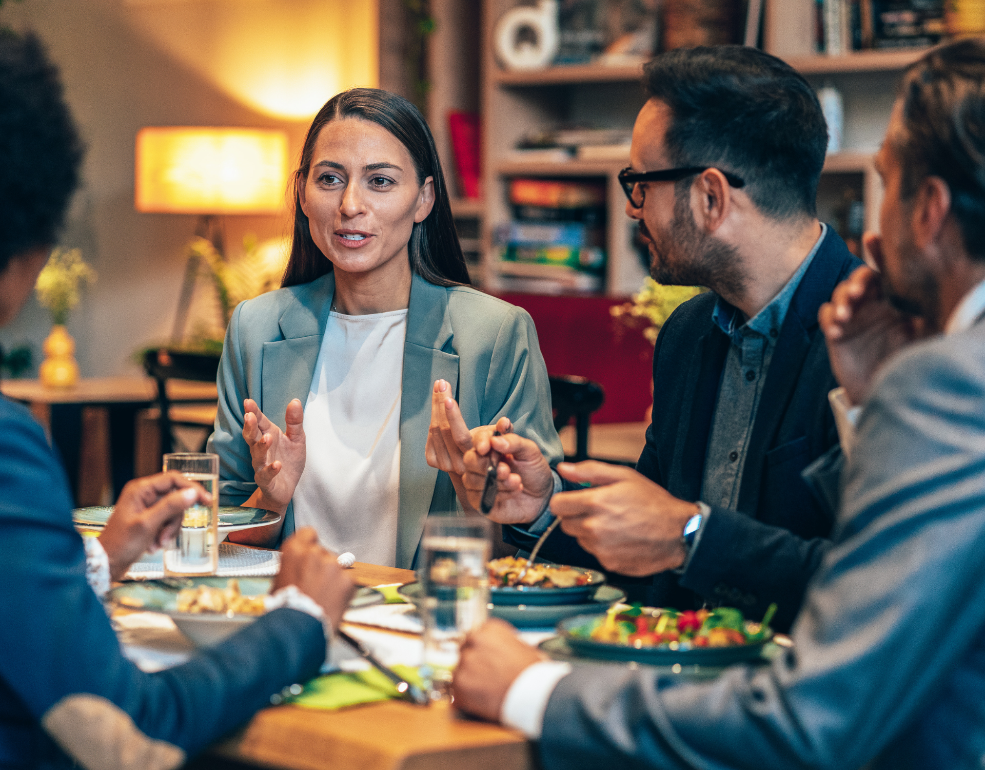 Professionals discussing ideas during a collaborative meeting representing impactful client work.