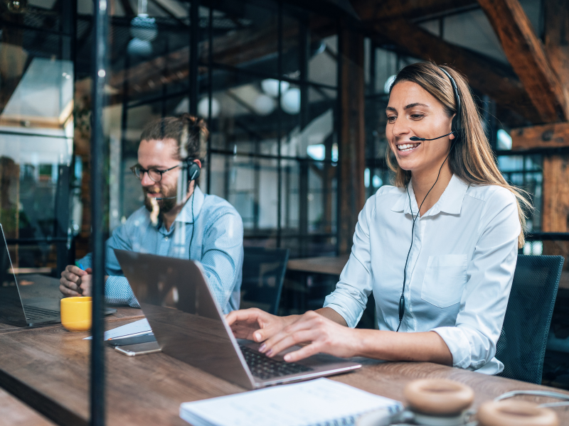 woman with a headset smiling