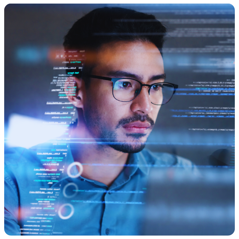 asian man in glasses analyzing data on a computer screen
