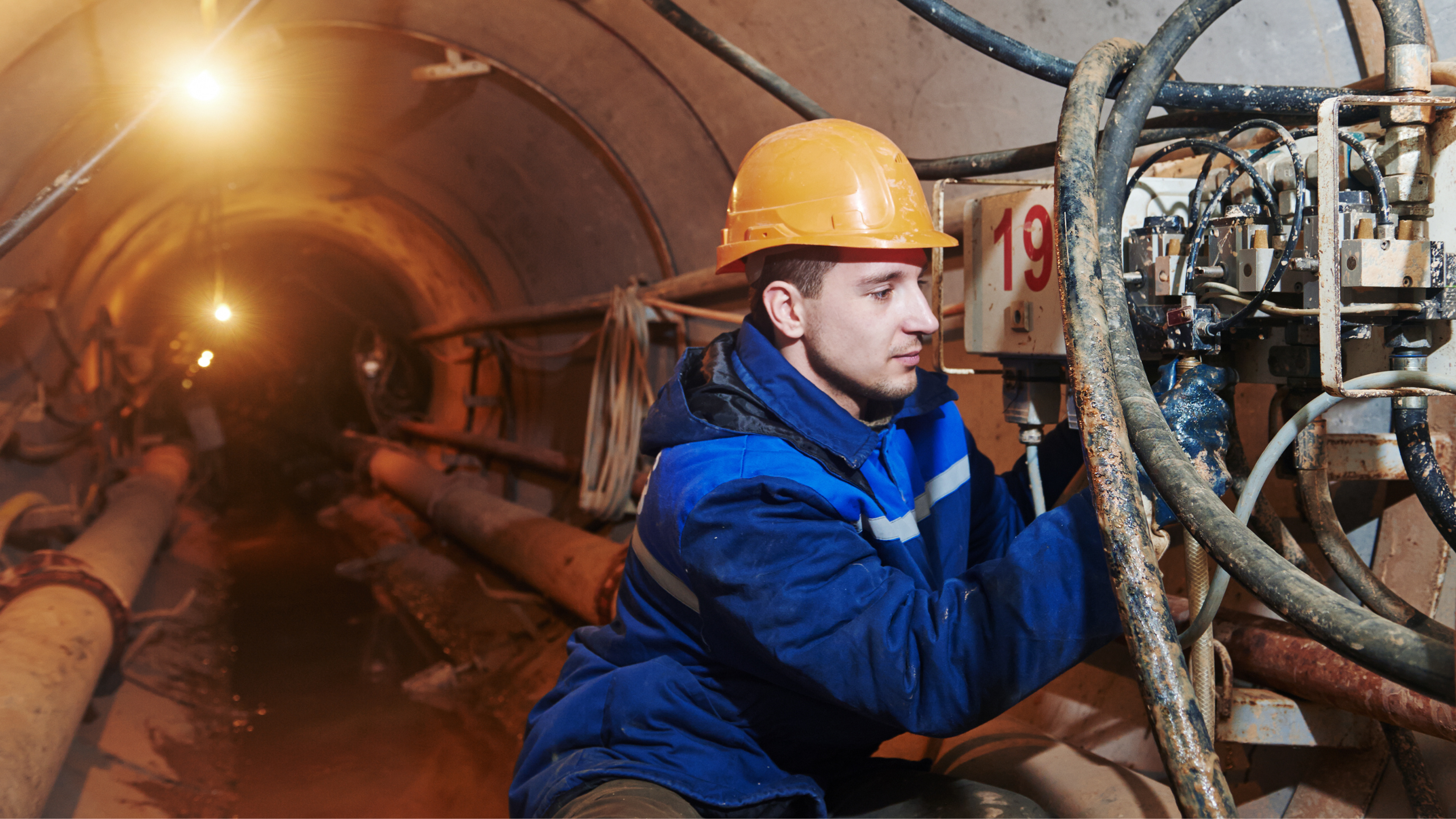 man working in underground tunnel