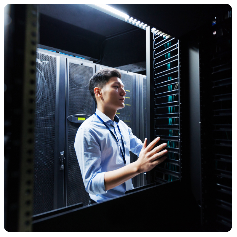 asian IT specialist servicing a data center