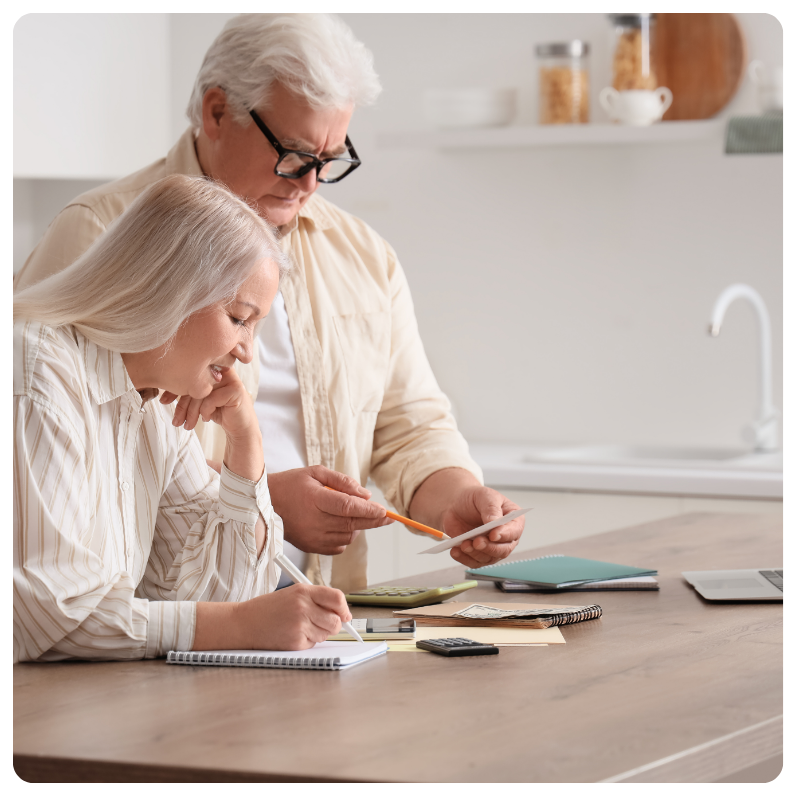 senior couple reviewing their bills