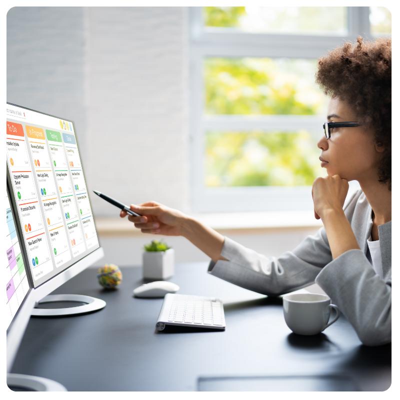 young black woman looking at tasks on computer